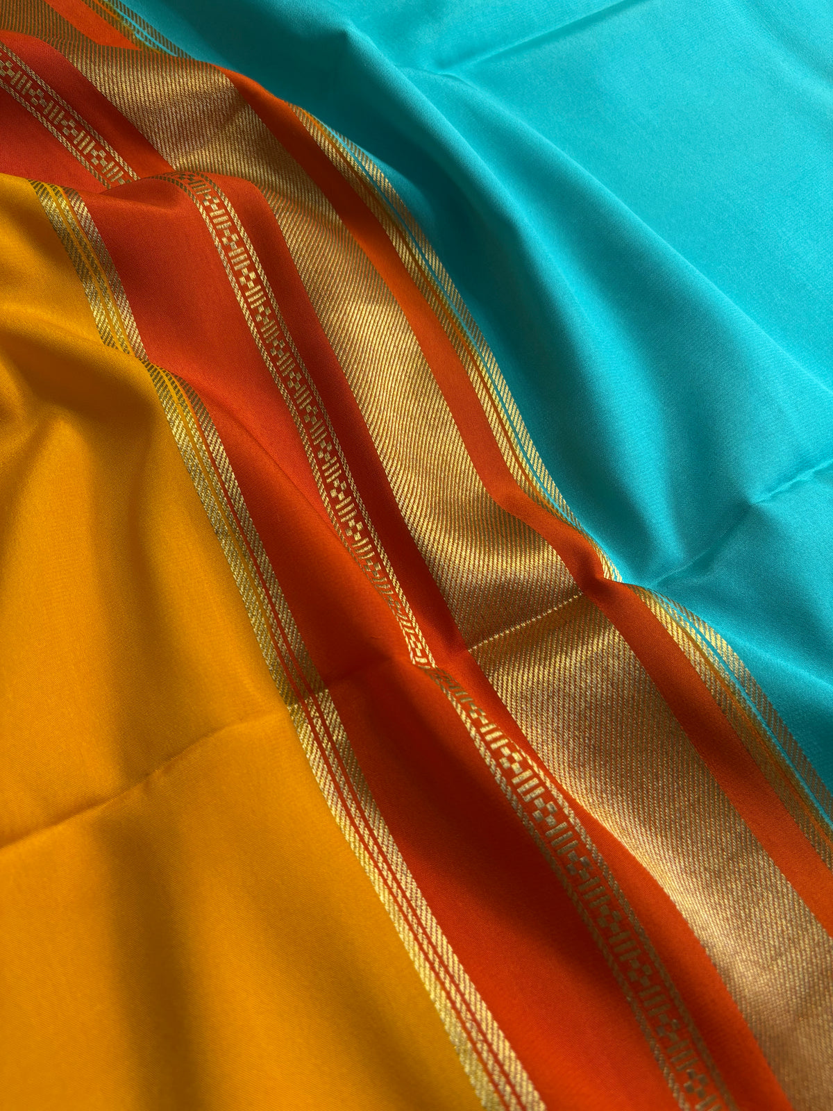 Triveni (3D) : Sea blue-orange-golden yellow