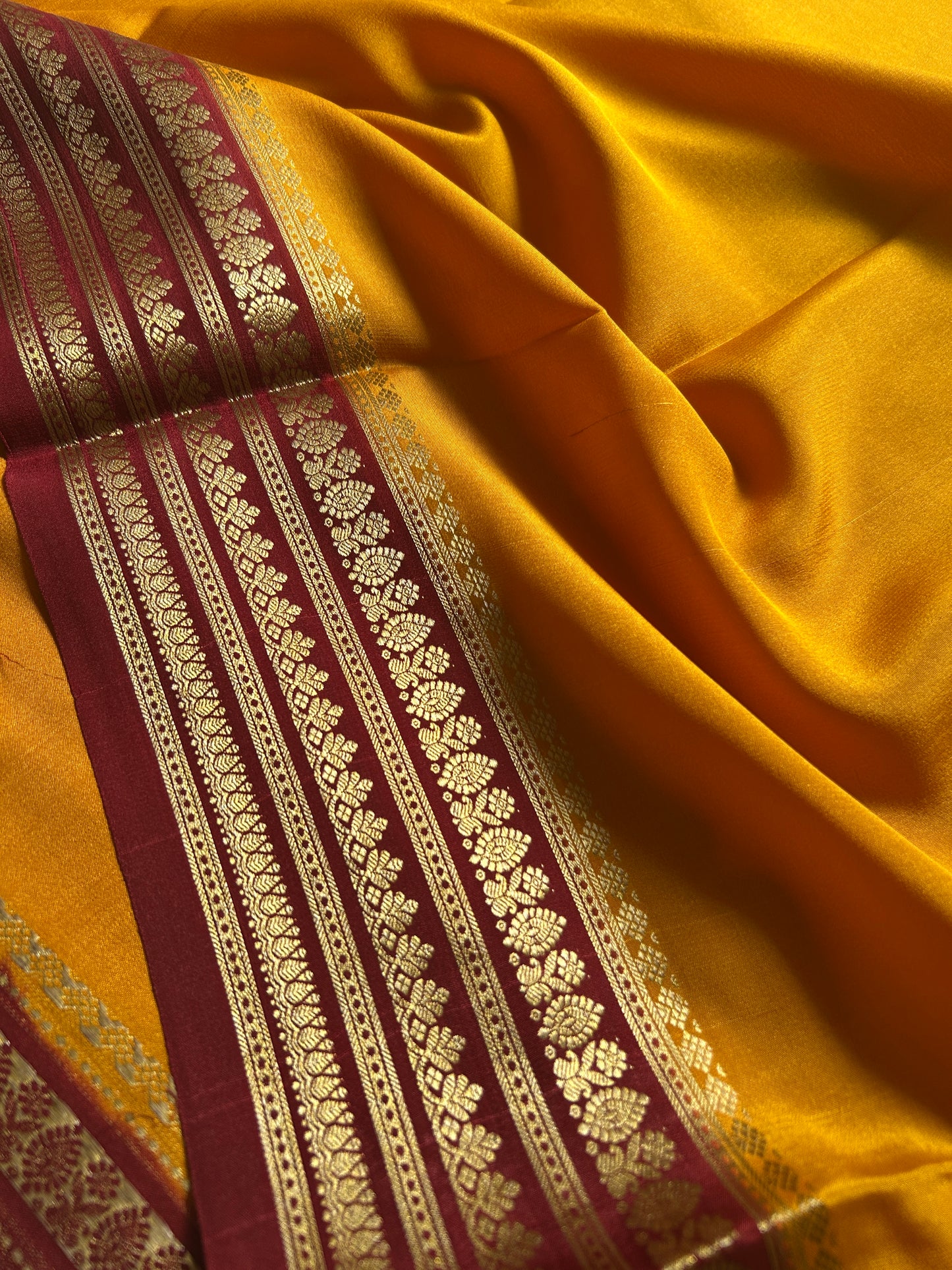 Manasa (2D) : Golden yellow-maroon