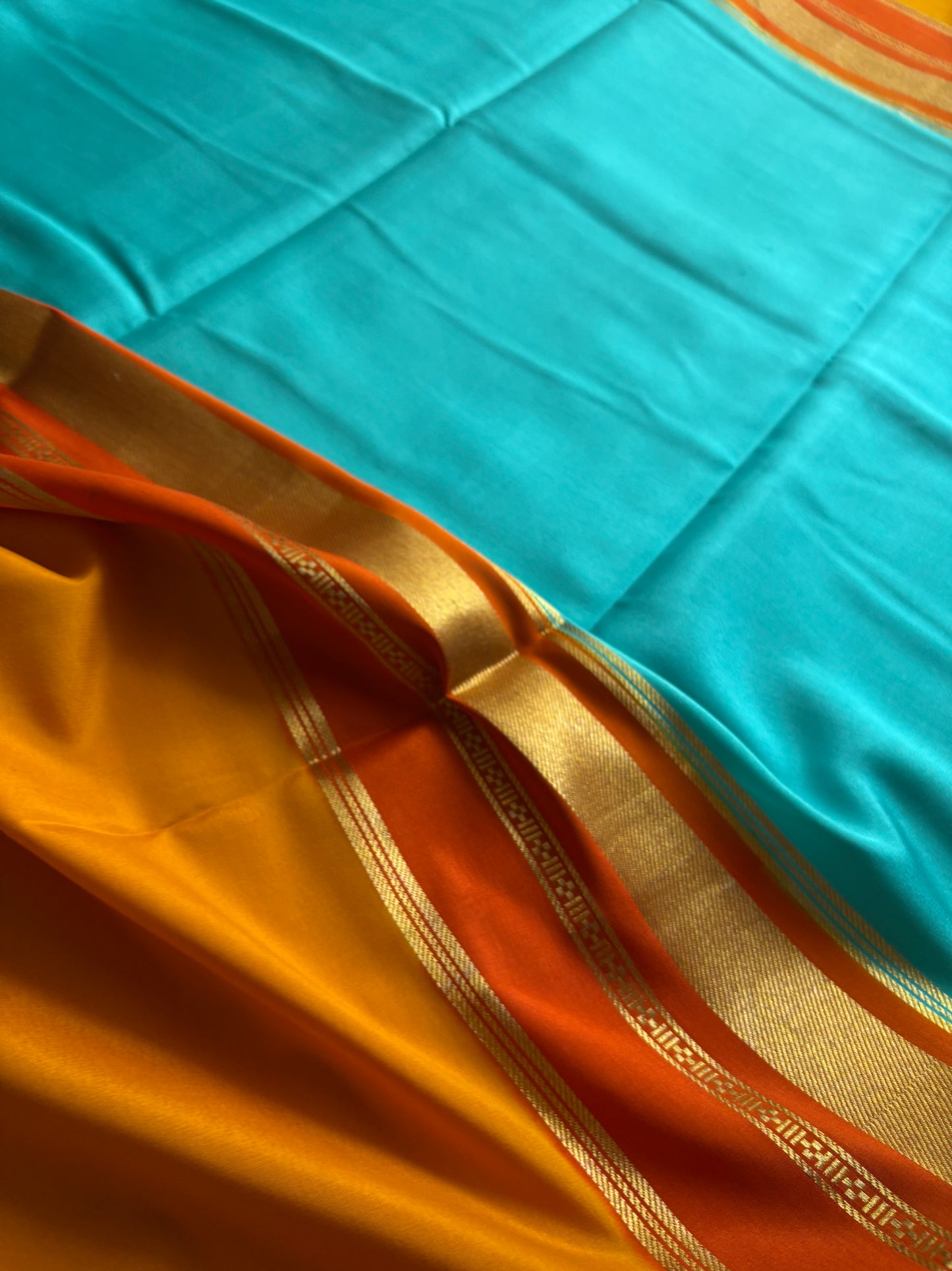 Triveni (3D) : Sea blue-orange-golden yellow